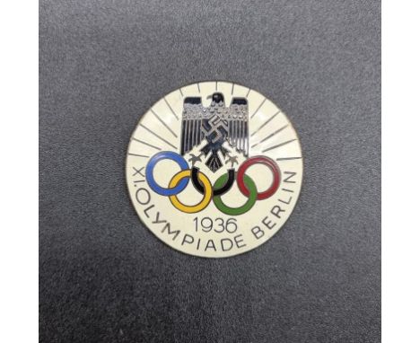 A 1936 Berlin Olympics enamel badge, marked 'H. Osang, Dresden', 4.5cm diameter.