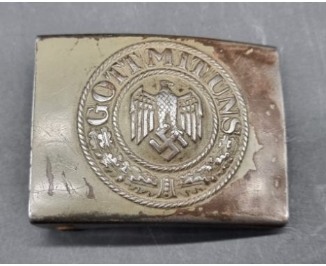 A WWII German Wehrmacht belt buckle, manufacturer's mark 'HK' for Hermann Koller.