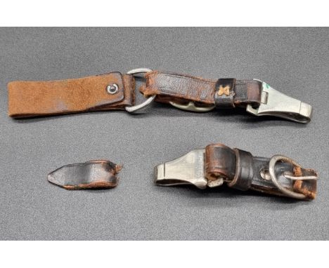 A German Third Reich dagger hanger clip, stamped 'A DRGM' and 'RZM M5/8', (s.d); together with another similar unmarked examp