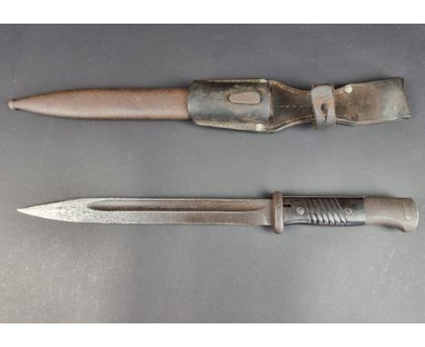 A German WWII K98/Mauser bayonet and scabbard, with leather frog.