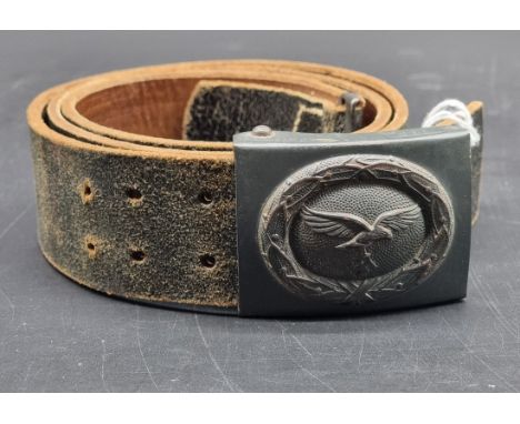 A WWII German Luftwaffe other ranks belt buckle,&nbsp;marked with manufacturer's code 'JFS.', on black leather belt, 110cm lo