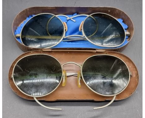 A cased pair of WWII British military sunglasses, the case inscribed 'Spectacles, Tinted, No.3, Case Mk II, Levers'; together