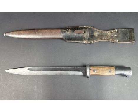 A German WWII K98 bayonet and scabbard, by&nbsp;cof (Carl Eickhorn, Solingen), the bayonet dated 44, the scabbard by the same