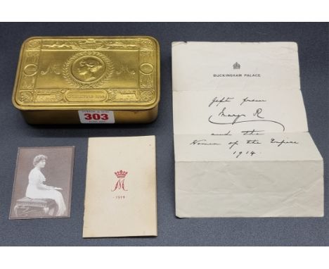 A WWI Princess Mary Christmas 1914 brass tin, complete with original tobacco, cigarettes, card, and photograph.