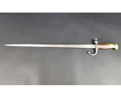 A French M1874 bayonet, the 52cm blade inscribed 'Paris-Oudry 1879'.