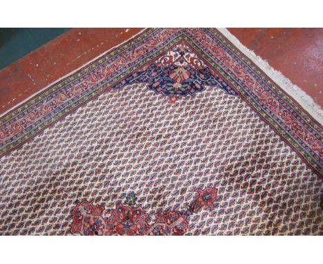  A Tabriz Carpet  , with a central pink medallion on a multi ghul field.244cm x 200cm 