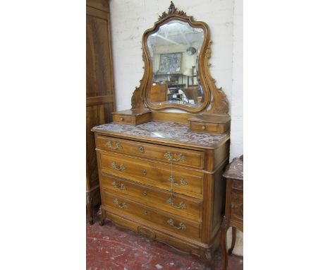  A 19th Century French walnut commode   with a bevelled dressing mirror, red veined top over four drawers.115 cm wide. 