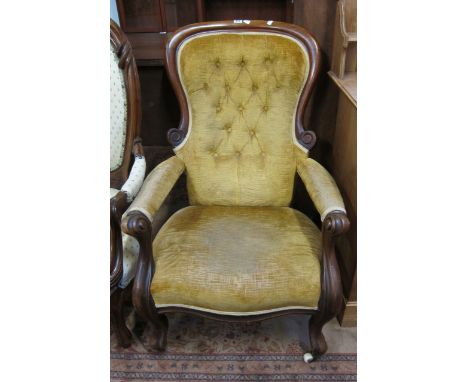  A Victorian mahogany armchair   with button back upholstery  