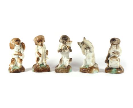 A set of five 19th century continental porcelain 'canine band' figures, max h. 12 cm Some losses