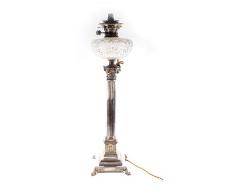 A silver plated oil lamp in the form of a Corinthian column, later converted to electricity, h. to top of reservoir 68 cm Con