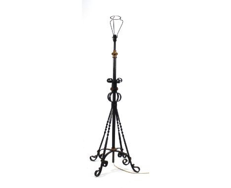 A wrought iron telescopic lamp standard on a quadruple scrolling base, h. 115 cm unextended  structurally sound, some surface