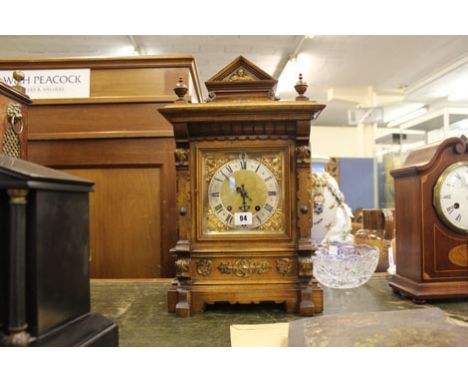 An Edwardian mantle clock in an 18th century walnut and gilt metal cased case of architectural form, h. 48 cm No guarantee as