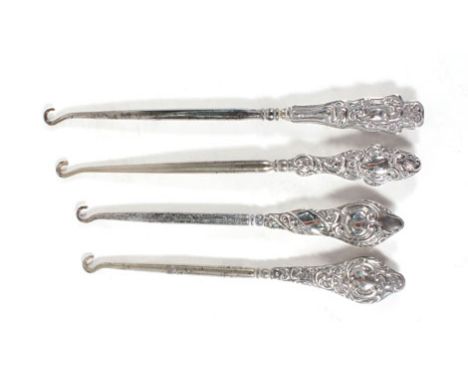 Four silver mounted button hooks, various dates and makers Some wear and tarnishing