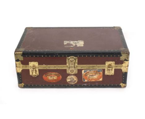 A 20th century steamer trunk with various labels including the White Star Line  Wear commensurate with age, LOCKED and with n