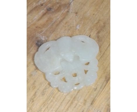 A Chinese mutton jade carving modelled as a bat above clouds, four character mark to reverse, length 6.5cm.Condition:- Genera