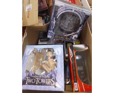 A box of assorted toys including Lord of the Rings, die-cast including Corgi etc.  