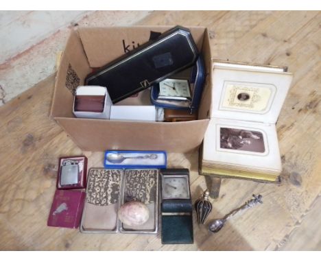 A box of assorted items including a white metal mounted horn scent bottle, a photograph album, snake skin wallet, lighter etc