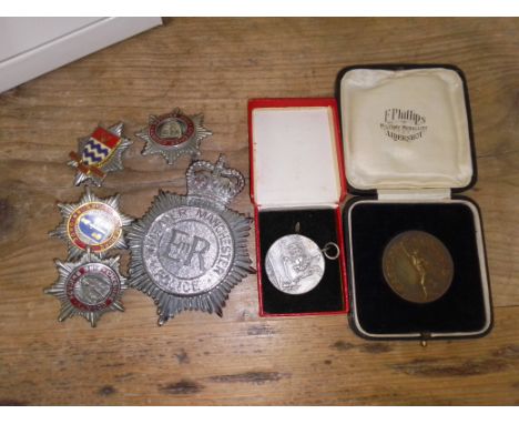 A box containing five assorted badges including GMP helmet badge plus two vintage boxed military medals for shooting and athl