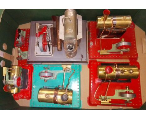 A box of assorted stationary live steam models comprising four Mamod engines and two accessories and a German stationary engi