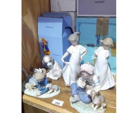 Three Lladro figures, two Nao figures and a Wedgwood Peter Rabbit nursery set.  