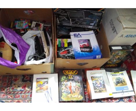 An Atari 502 console with accessories and games together with 3 Sinclair ZX Spectrum consoles with accessories, games, contro