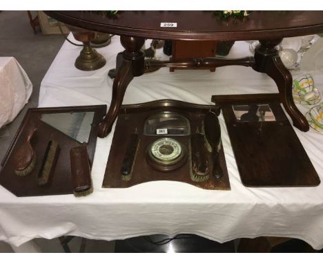 3 mirror backed brush wall hangings one with a barometer