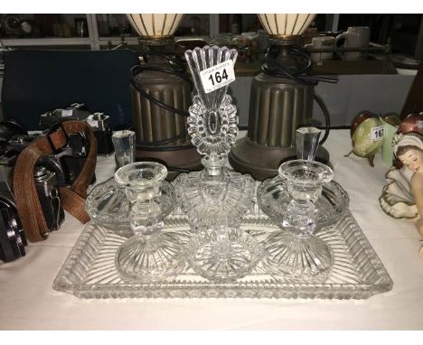 A cut glass trinket set with ornate perfume bottle