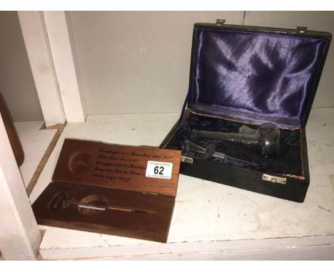 A cased smoking set and cased champagne thermometer