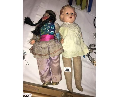 2 vintage dolls with plastic heads
