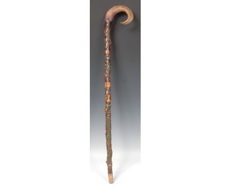 An early 20th century gypsy walking stick, probably chestnut, carved and brightly painted with flowers and leaves, ram's horn