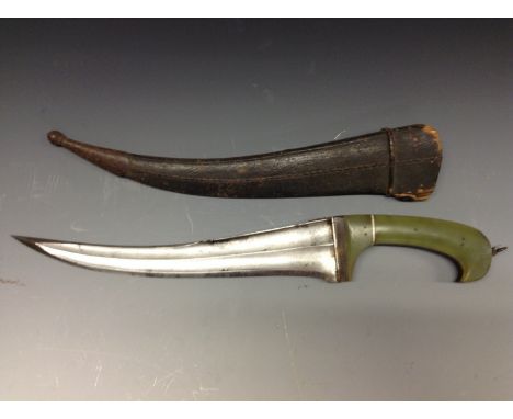 An Indian khanjar dagger, curved fullered blade, 27cm curved fullered blade, two-piece jade coloured grip, steel mounted leat