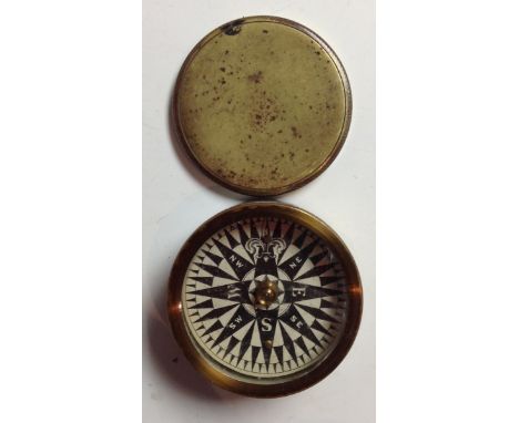 A 19th century brass travelling compass, push fitting cover, 8cm diam