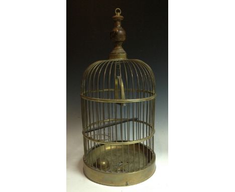 A late Victorian gilt brass domed bird cage, turned baluster finial with brass suspension loop, perching rail, circular brass