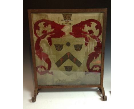 An 18th century silk work armorial panel, 49.5cm x 44cm, later mounted as a firescreen

The shield bears the arms of Snassell