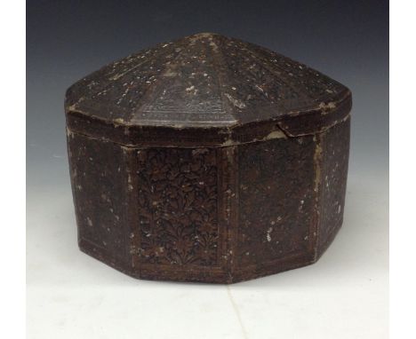 A 19th century Indian decagonal papier mâché box and cover, pressed and picked out in colours with ornate foliage in compartm