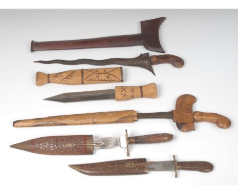 A Malaysian kris, 28.5cm blade, wooden hilt and scabbard, 44cm long overall; another; etc (5)