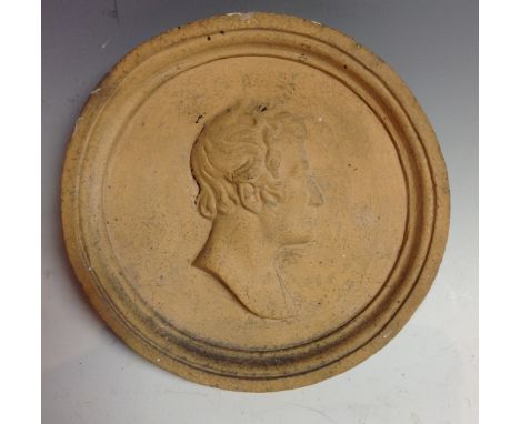 A 19th century earthenware portrait roundel, moulded in relief with the head of a gentleman in profile, 16.5cm diam, c.1860