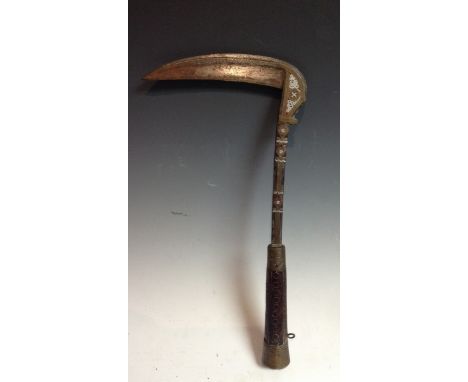 An Afghan lohar war axe or pick, curved blade, damascened stem, hardwood grip carved with roundels nad geometric bands, 36cm 