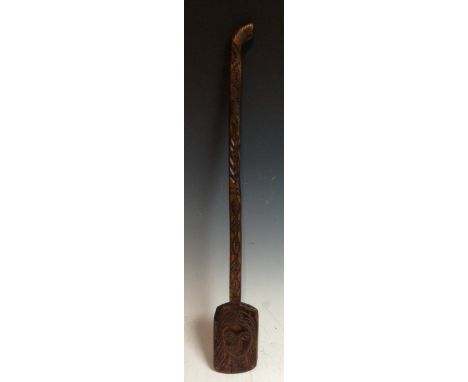 Folk Art - a 19th century ladle, the bowl boldly carved with a maiden, the stem and terminal with geometric motifs, 53cm long