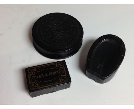 A 19th century lignum vitae circular snuff box, carved with a central roundel, flanked by a field of spheres, push-on cover, 