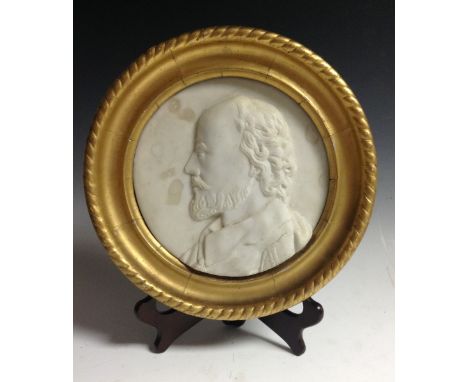 A Grand Tour carrara marble portrait roundel, carved in relief with a profile portrait of a bearded Renaissance gentleman, 19