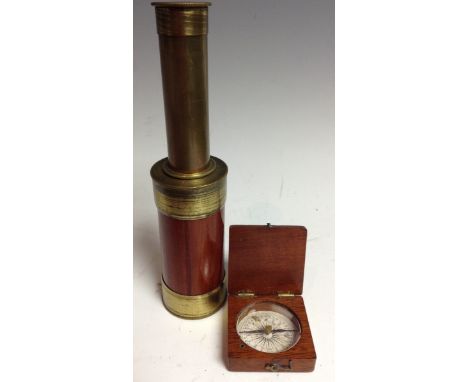 An early 20th century mahogany miniature travelling pocket compass, hinged cover, 4cm wide; a two-draw pocket telescope, exte
