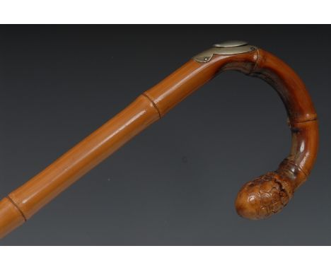 An early 20th century bamboo horse measuring walking stick, curved handle, the shaft enclosing a boxwood scale, plated mount 