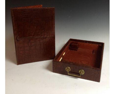 An early 20th century crocodile skin rectangular travelling document and correspondance box, the watered silk interior fitted
