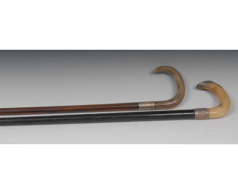 An early 20th century silver mounted walking stick, horn handle, silver collar, Birmingham 1921;  another, ebonised shaft,  B