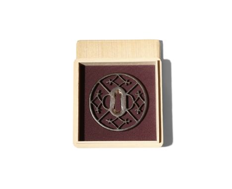 A JAPANESE IRON OWARI TSUBA EDO PERIOD, 17TH CENTURY Of circular form, decorated in openwork with geometric designs of rhombo