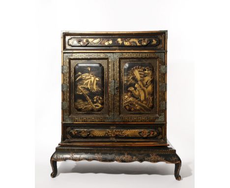 A JAPANESE LACQUER KODANSU CABINET AND STAND MEIJI PERIOD, 19TH CENTURY Of rectangular form, the two front doors opening to r