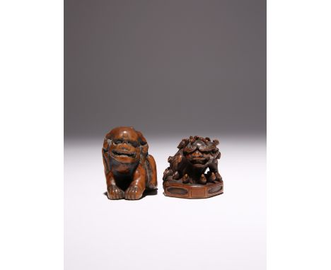 TWO LARGE WOOD NETSUKE OF SHISHI EDO AND MEIJI PERIODS, 18TH AND 19TH CENTURIES The first lion dog depicted on an octagonal p