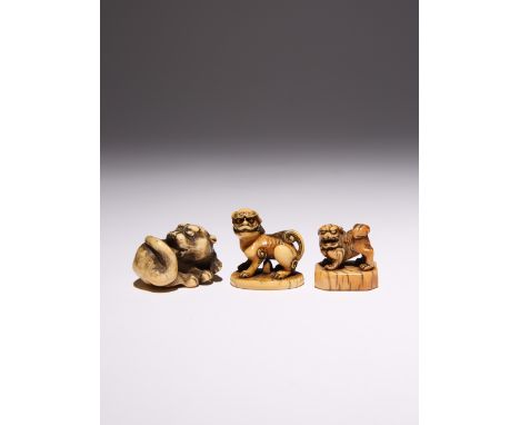 THREE JAPANESE IVORY NETSUKE OF FELINES EDO AND MEIJI PERIOD, 18TH AND 19TH CENTURY One carved as a reclining tiger licking i