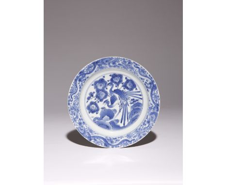 A RARE JAPANESE AI KAKIEMON BLUE AND WHITE DISH EDO PERIOD, C.1670 The well decorated with two ho-o birds perched on a flower